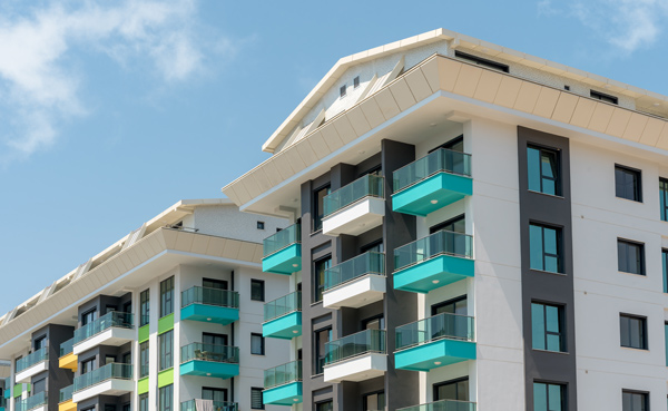 modern apartment buildings with balconies and vibrant colors showcasing architectural design six stories high